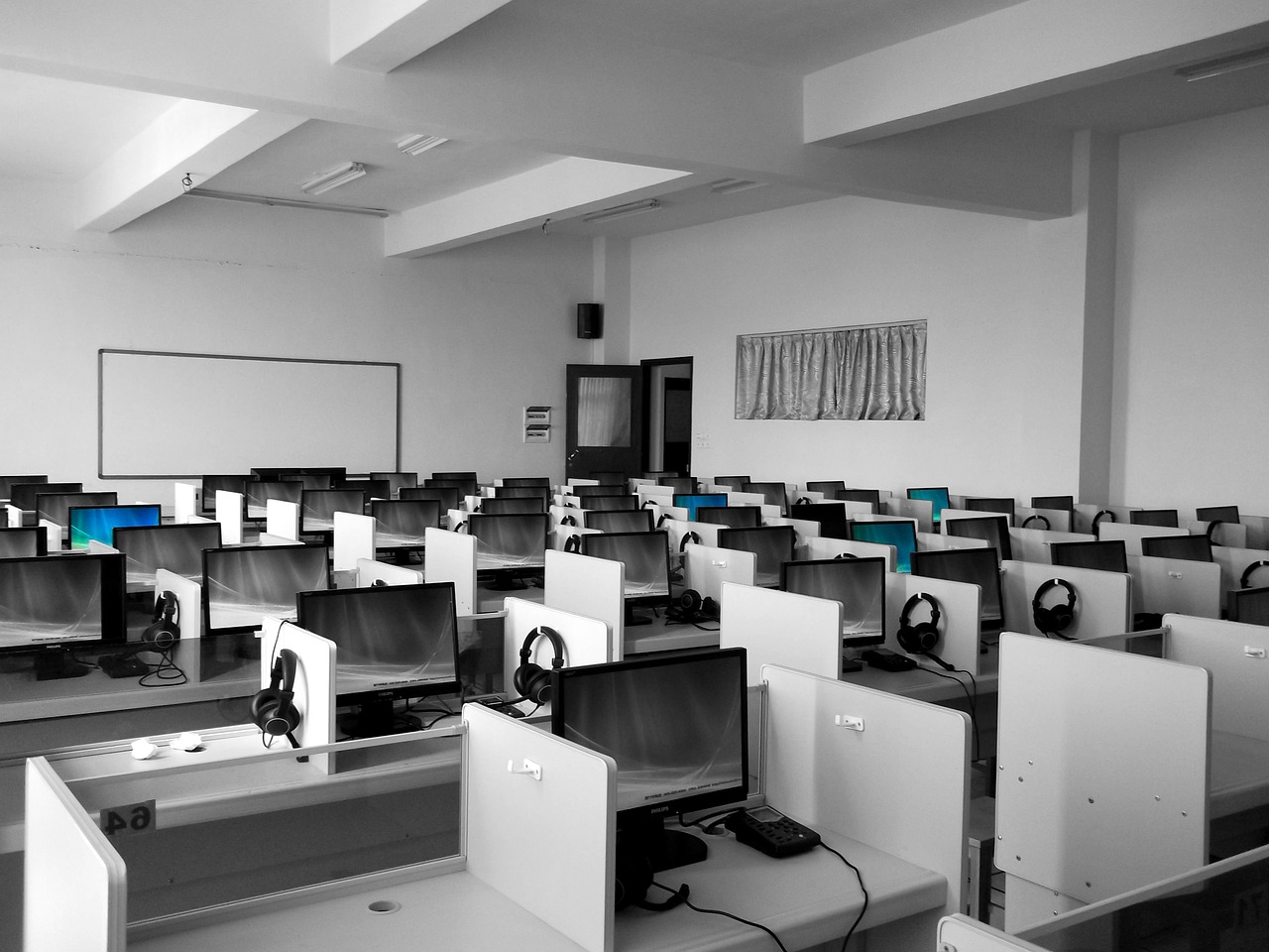 Blank white cubicles with computers reflect Stanford's changing culture as more Stanford grads pursue six-figure stability over innovation.