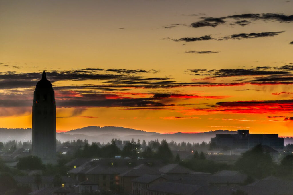 Stanford's changing culture mirrors its changing campus. A dreamy photo of Stanford's architecture at twilight.